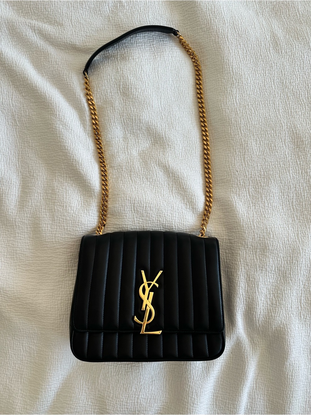 Saint Laurent Black VICKY Matelasse medium shoulder bag with gold chain.